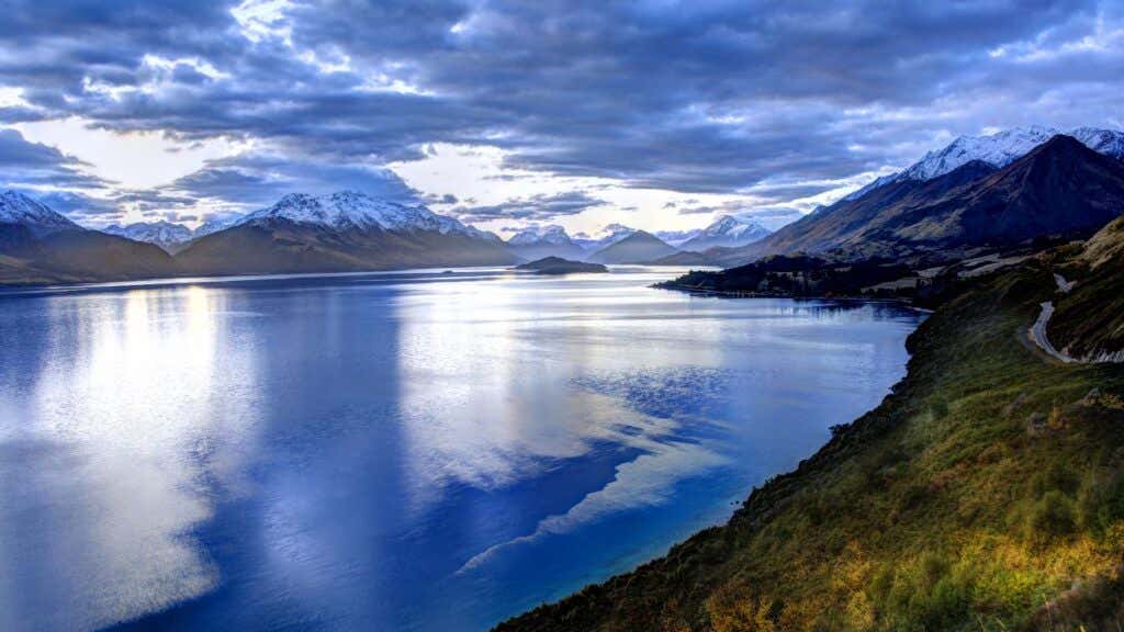 lake surrounded by snow-capped mountains